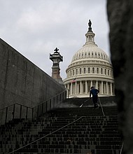 A worker cleans the steps near the U.S. Capitol in Washington, D.C. on June 22. Senate Republicans are expected to block a vote July 21 to start debate on a $1.2 trillion bipartisan infrastructure bill, as they push for more time to strike a deal with Democrats and write the legislation.
Mandatory Credit:	Stefani Reynolds/Bloomberg/Getty Images