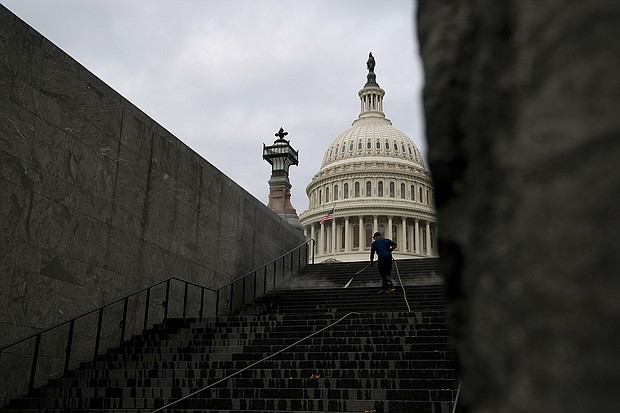 A worker cleans the steps near the U.S. Capitol in Washington, D.C. on June 22. Senate Republicans are expected to block a vote July 21 to start debate on a $1.2 trillion bipartisan infrastructure bill, as they push for more time to strike a deal with Democrats and write the legislation.
Mandatory Credit:	Stefani Reynolds/Bloomberg/Getty Images