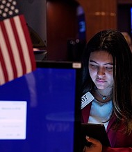 Trader Ashley Lara works on the floor of the New York Stock Exchange on July 20. When the market is plunging, it's tempting to throw in the towel and sell. But dumping stocks on days when the Dow is getting whacked is usually the wrong thing to do.
Mandatory Credit:	Richard Drew/AP