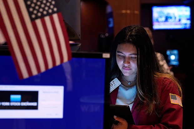 Trader Ashley Lara works on the floor of the New York Stock Exchange on July 20. When the market is plunging, it's tempting to throw in the towel and sell. But dumping stocks on days when the Dow is getting whacked is usually the wrong thing to do.
Mandatory Credit: Richard Drew/AP