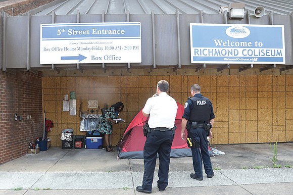 Homeless residents of a small tent city outside the vacant Richmond Coliseum received a final notice to move before a ...