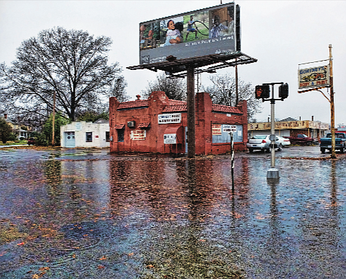 In this file photo, rainwater floods the intersection of Overbrook Road and Lombardy Street in North Side. About one-third of Richmond’s storm drainage is tied into its sewer system, mostly in the East End, North Side and Downtown.