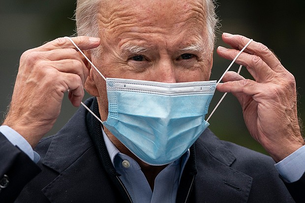 Then-Democratic presidential nominee Joe Biden puts on a face mask while speaking to reporters at a voter mobilization center on October 26, 2020, in Chester, Pennsylvania.
Mandatory Credit:	Drew Angerer/Getty Images	Then-Democratic presidential nominee Joe Biden puts on a face mask while speaking to reporters at a voter mobilization center on October 26, 2020, in Chester, Pennsylvania.
Mandatory Credit:	Drew Angerer/Getty Images