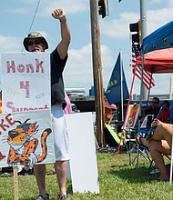 Ron Sadler, a Frito-Lay employee for 32 years, raises a fist as drivers show support for the union strike on July 20.
Mandatory Credit:	Evert Nelson/USA Today Network