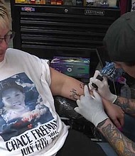 Tattoo artist Beau Wofford donated all of th money he earned on July 24 to a famly who had three children die in a Kansas City, Missouri, house fire.
Mandatory Credit:	KMBC