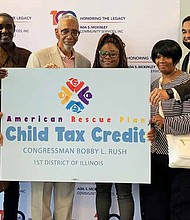 Congressman Bobby Rush joined families from Ada S. McKinley to discuss the benefits of the Child Tax Credit. Photo by Tia Carol Jones
