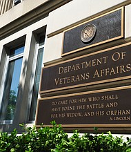 This May 19, 2014 photo shows a sign in front of the Veterans Affairs building in Washington, DC. The Department of Veterans Affairs will require many of its frontline health workers to be vaccinated, a senior administration official told CNN on July 26.
Mandatory Credit: KAREN BLEIER/AFP/Getty Images
