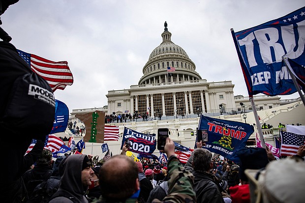 Pro-Trump supporters storm the U.S. Capitol following a rally with President Donald Trump on January 6. The Justice Department formally declined to assert executive privilege for potential testimony of at least some witnesses related to the January 6 Capitol attack.
Mandatory Credit:	Samuel Corum/Getty Images