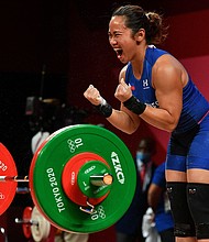 Philippines' Hidilyn Diaz reacts while competing in the women's 55kg weightlifting competition during the Tokyo 2020 Olympic Games.
Mandatory Credit: Vincenzo Pinto/AFP/Getty Images