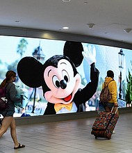 The mayor of the Florida county that's home to Disney World and Universal Studios is sounding the alarm on a spike of Covid-19 cases in the area, saying the county is now in "crisis mode" as it grapples with its worsening infection rate.
Mandatory Credit: Paul Hennessy/SOPA Images/LightRocket/Getty Images/FILE