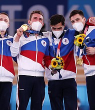 Gymnasts from Team ROC pose with the gold medal after winning the Men's Team Final on day three of the Tokyo Olympic Games.
Mandatory Credit: Jamie Squire/Getty Images