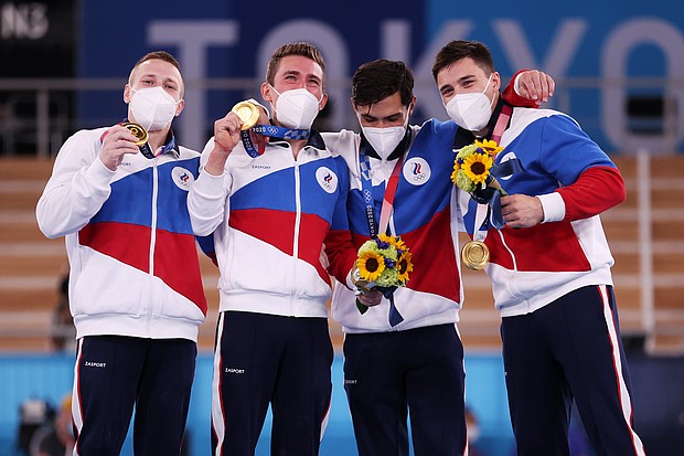 Gymnasts from Team ROC pose with the gold medal after winning the Men's Team Final on day three of the Tokyo Olympic Games.
Mandatory Credit:	Jamie Squire/Getty Images