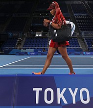 Naomi Osaka leaves the court after defeat in her third-round match against Marketa Vondrousova on day four of the Tokyo 2020 Olympic Games at Ariake Tennis Park on July 27 in Tokyo.
Mandatory Credit: David Ramos/Getty Images