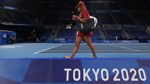 Naomi Osaka leaves the court after defeat in her third-round match against Marketa Vondrousova on day four of the Tokyo 2020 Olympic Games at Ariake Tennis Park on July 27 in Tokyo.
Mandatory Credit: David Ramos/Getty Images