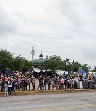 Migrants who were sent back to Mexico under Title 42 wait in line for food and supplies in a camp across the US-Mexico border in Reynosa, Tamaulipas, Mexico on July 10.
Mandatory Credit: Paul Ratje/AFP/Getty Images