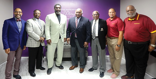 Faith leaders and football/Virginia Union University football team chaplain, the Rev. Joe Ellison, right, gathers with honorees at the 4th Annual Washington Football Team/RVA Faith Leaders Luncheon on Monday at New Kingdom Christian Ministries on Dill Avenue in Highland Park. The luncheon was co-hosted by Rev. Ellison and the church’s senior pastor, Dr. Christopher Moore, left, to honor four Black College Football Hall of Famers. They are, beginning second from left, Virginia Union University Athletic Director Joe Taylor; former Washington Football Team quarterback and Super Bowl MVP Doug Williams, who is now special adviser to the WFT president; Willie E. Lanier, former NFL Kansas City Chiefs player and Pro Football Hall of Famer whose stellar football career started at Maggie L. Walker High School in Richmond; and Coach Willard Bailey, who coached four Virginia teams during an illustrious career at VUU, Norfolk State University, the former St. Paul’s College and Virginia University of Lynchburg. Coach Bailey is the newest inductee in the Black College Football Hall of Fame; he was inducted in June. Joining the group also is the WFT Senior Team Chaplain Bishop Brett Fuller, second from right.