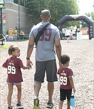 Welcoming the burgundy and gold/There’s no doubt that the Washington Football Team has real diehard fans in Richmond. After a year’s hiatus because of COVID-19, the NFL team received a big welcome back to its Richmond training camp on Wednesday by fans who turned out in droves.  Many wore the team colors of burgundy and gold. Left, Theiss Wooten and his children, Aryanna, 6, left, and Jayden, 3, drove up from Williamsburg to catch a bit of the action before they had to return for Aryanna’s gymnastics class.