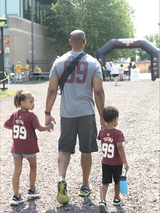 Welcoming the burgundy and gold/There’s no doubt that the Washington Football Team has real diehard fans in Richmond. After a year’s hiatus because of COVID-19, the NFL team received a big welcome back to its Richmond training camp on Wednesday by fans who turned out in droves.  Many wore the team colors of burgundy and gold. Left, Theiss Wooten and his children, Aryanna, 6, left, and Jayden, 3, drove up from Williamsburg to catch a bit of the action before they had to return for Aryanna’s gymnastics class.