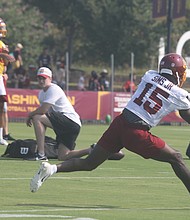 Steven Sims Jr., a wide receiver for the Washington Football Team, stretches to make the catch during practice Wednesday morning at the team’s Richmond training camp at 2401 W. Leigh St. Fans were on hand for the session.