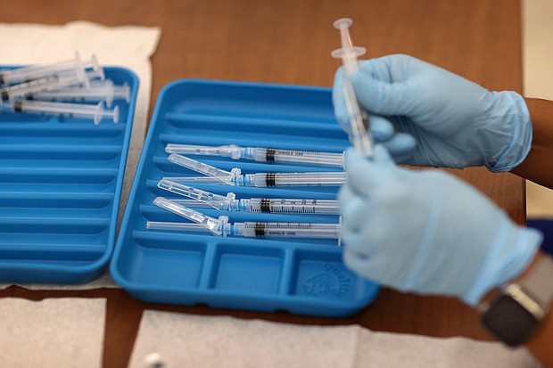 A healthcare worker prepares Moderna COVID-19 vaccines at a clinic on May 20, 2021, in Immokalee, Florida.
Mandatory Credit:	Joe Raedle/Getty Images
