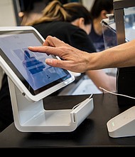 Square anounced Sunday that it's buying Afterpay for $29 billion. A customer uses a Square Inc. device to make a payment in San Francisco, California, on March 27, 2018.
Mandatory Credit:	David Paul Morris/Bloomberg via Getty Images