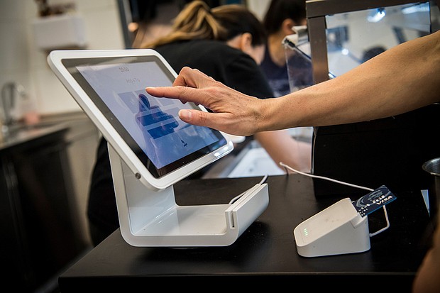 Square anounced Sunday that it's buying Afterpay for $29 billion. A customer uses a Square Inc. device to make a payment in San Francisco, California, on March 27, 2018.
Mandatory Credit:	David Paul Morris/Bloomberg via Getty Images