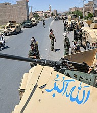 US airstrikes pound Taliban positions as militants threaten key cities in Afghanistan. This image shows an Afghan National Army commando in Herat province on August 1.
Mandatory Credit:	Hoshang Hashimi/AFP/Getty Images