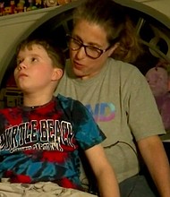 Jadon Ringland, a 12-year-old student, faces felony charges after threatening to burn people and property at his school. But, he has Autism and his family argues, the proper protocols for students with disabilities were not followed prior to charges being filed. Jadon is seen here with his mother, Tovah.
Mandatory Credit:	WGCL