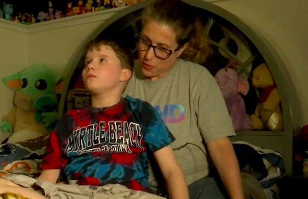 Jadon Ringland, a 12-year-old student, faces felony charges after threatening to burn people and property at his school. But, he has Autism and his family argues, the proper protocols for students with disabilities were not followed prior to charges being filed. Jadon is seen here with his mother, Tovah.
Mandatory Credit:	WGCL