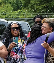 Cityscape: Slices of life and scenes in Richmond:Above left, Richmond residents gather outside the refurbished Annie Marie Giles Community Resource & Training Center in Shockoe Valley for the grand reopening celebration last Saturday. Born as a school and used for several years as a homeless shelter, the building is now to host programs that benefit residents in the East View community and the Whitcomb and Mosby public housing communities located on the hills above Shockoe Valley. Florence Smith, the eldest daughter of the late Mrs. Giles, gives City Councilwoman Ellen F. Robertson a hug for her work to provide a center of which Mrs. Giles would be proud. Ms. Robertson led the charge to get the city to purchase the building, to name the center for the late Mrs. Giles, an influential Whitcomb Court resident who was an organizer and activist for residents, and to use the center for operations that would provide job training and other services.