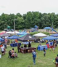 Getting ready for school/The Broad Rock Sports Complex on Old Warwick Road in South Side became a festival of sorts last Saturday as the venue for RPS Summer Fest. The event, sponsored by Richmond Public Schools, featured games, entertainment, food and information on how to enroll students in school this fall along with other community resources. Barber Alonzo Bosher trims the braids of Tyler Sims, 5, as he gets ready for class in September. This was the second Summer Fest hosted by the school system. The first was held July 24 at Martin Luther King Jr. Middle School.