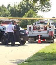 Authorities survey the scene of a double homicide in Oklahoma City on August 7.
Mandatory Credit:	KOCO