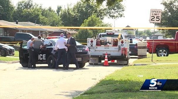 Authorities survey the scene of a double homicide in Oklahoma City on August 7.
Mandatory Credit:	KOCO