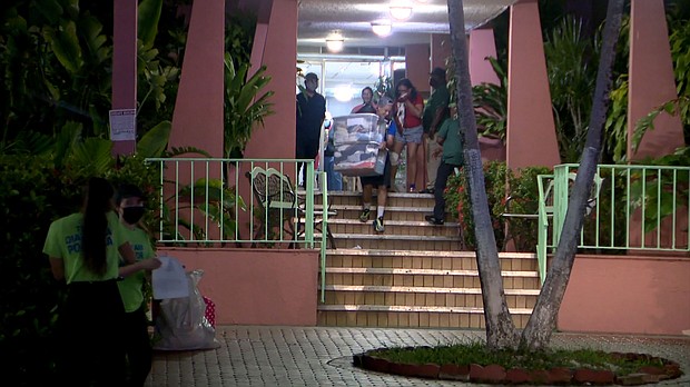 Residents evacuate a building in Miami's Flagami neighborhood.
Mandatory Credit:	WFOR