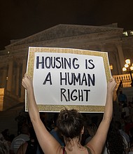 US health officials issued a new eviction moratorium on August 3, temporarily barring landlords from removing tenants in regions with substantial or high Covid-19 transmission rates, and pictured, demonstrators in Washington DC., on August 1.
Mandatory Credit:	Stefani Reynolds/Bloomberg/Getty Images