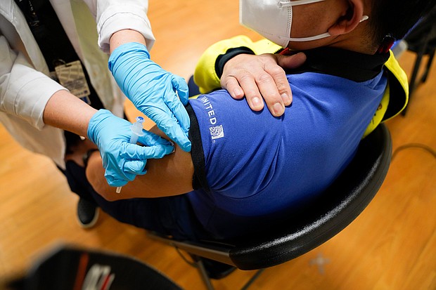 United Airlines now requires employees to get vaccinated against Covid-19, the first major US airline to implement such a mandate.
Mandatory Credit:	Wayne Slezak/United