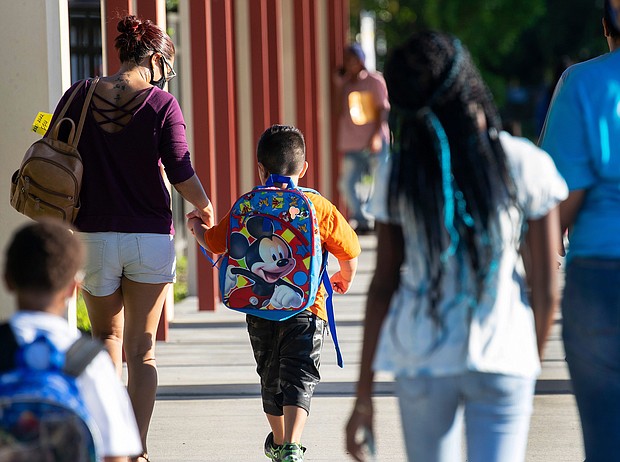 Parents of Tice Elementary School students drop their kids off for the first day of school in Fort Myers, Florida, on August 10.
Mandatory Credit:	Amanda Inscore/The News-Press/USA Today Network