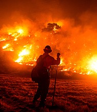 Federal wildland firefighters, who currently make as little as $13.45 an hour, could get a long-awaited pay raise if the bipartisan infrastructure package making its way through Congress eventually gets to President Joe Biden's desk.
Mandatory Credit:	Ringo Chiu/AFP/Getty Images