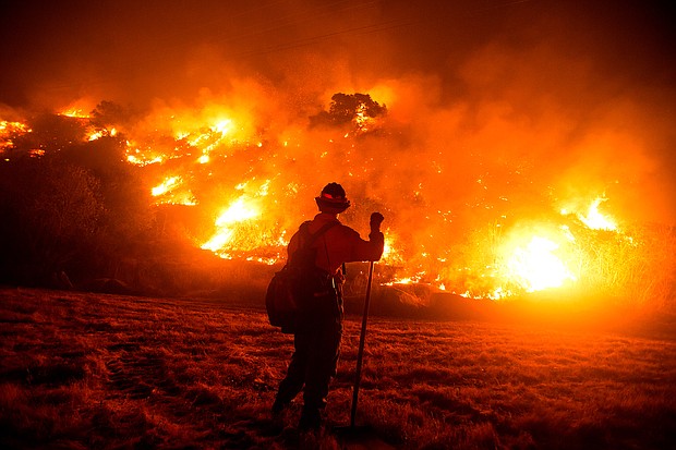 Federal wildland firefighters, who currently make as little as $13.45 an hour, could get a long-awaited pay raise if the bipartisan infrastructure package making its way through Congress eventually gets to President Joe Biden's desk.
Mandatory Credit:	Ringo Chiu/AFP/Getty Images