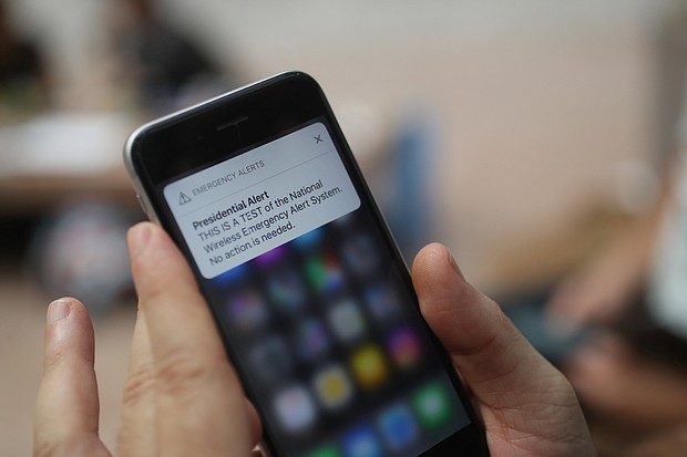 A test of the wireless emergency alert system is displayed on an iPhone.
Mandatory Credit:	Andrew Harrer/Bloomberg/Getty Images