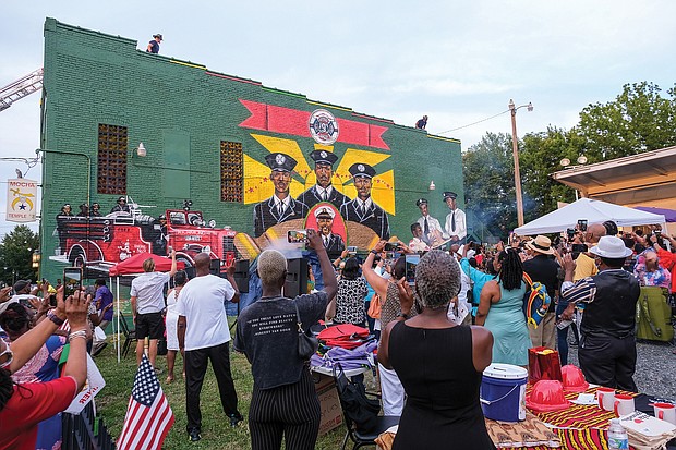 Scores of people turned out Aug. 6 for the official unveiling of the mural honoring the first Black firefighters hired by the City of Richmond. The 10 trailblazers were hired July 1, 1950, and were stationed at Engine Company No. 9 at 5th and Duval streets in Jackson Ward. The commemorative mural was done by local artists Sir James Thornhill, Jason Ford and Kevin Orlosky, and is situated on the side of the Mocha Temple No. 7 Shrine building at 613 N. 2nd St. in Jackson Ward. The unveiling was the kickoff of a weekend of activities sponsored by Engine Company #9 and Associates remembering and honoring the original firefighters.