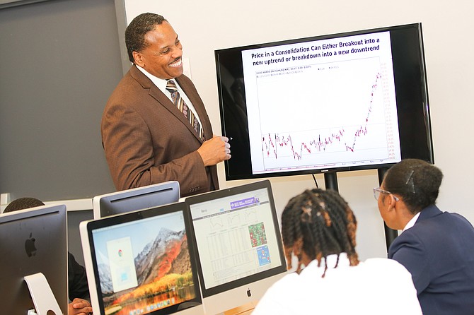 Dr. Noah Nicholson II, President of The ARK and Pastor of The Family Worship Center, as well as President/CEO of Global Investments, teaches the children about Stock Investing and Leadership
Development. Photos by Nicole Ashley Gee