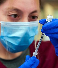 The Biden administration is expected to announce that booster doses will be needed for most people who received the Covid-19 vaccine.
Mandatory Credit:	Irfan Khan/Los Angeles Times via Getty Images