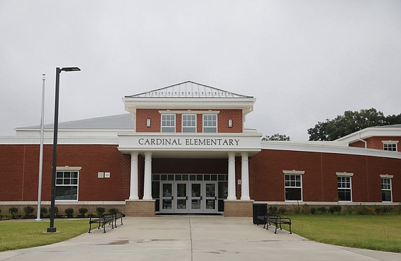 It was a monumental moment Monday as the ribbon was cut officially opening Cardinal Elementary School in South Side.