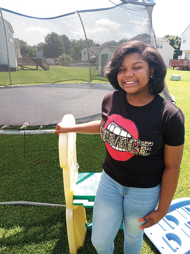 Chyna-Marie Johnson, a rising eighth-grader at John Rolfe Middle School, sometimes comes up with her anti-bullying raps while playing on the trampoline.