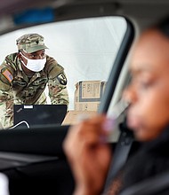 A driver administers a self-collected nasal swab at a Covid-19 drive-through testing site operated by the National Guard on August 11, in New Orleans, Louisiana.
Mandatory Credit:	Mario Tama/Getty Images