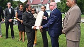 At right, Nathan Burrell, left, with the Virginia Department of Conservation and Recreation receives headstone from Maryland Gov. Larry Hogan.
