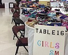 In this 2019 photo, new shoes of all sizes are set up on tables at Third Street Bethel AME Church for youngsters to select before the first day of school. With the pandemic, school principals will work this year with participating churches to get shoes for students who request them.