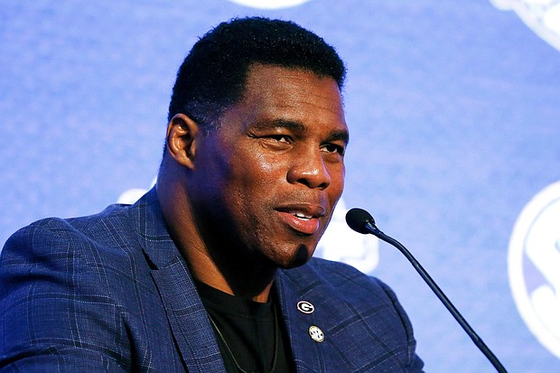 Former football star Herschel Walker announced his campaign for US Senate in Georgia on Wednesday. Walker is seen here In this July 16, 2019 file photo, in Hoover, Alabama.
Mandatory Credit:	Butch Dill/AP
