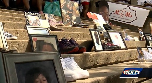 A memorial at the August 29 Mothers of Murdered Sons and Daughters event in Louisville shows some of the victims of violence.
Mandatory Credit:	WLKY